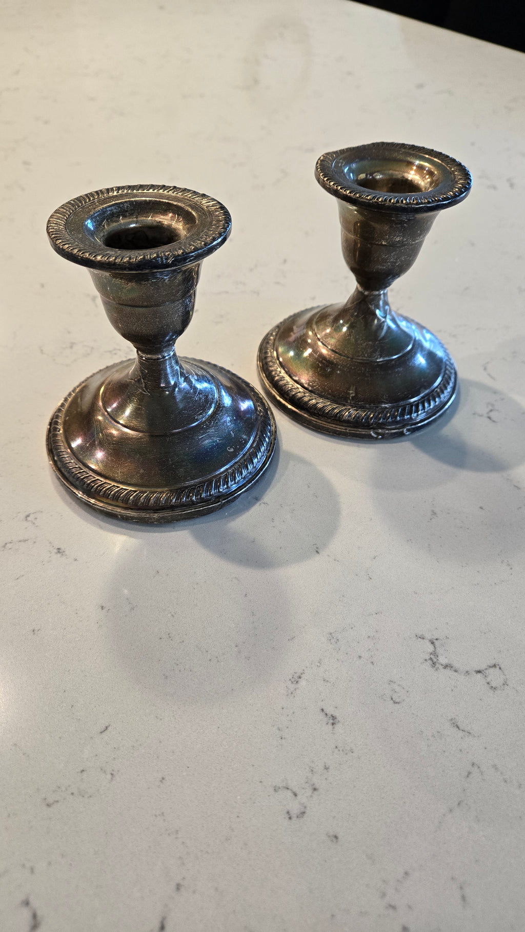 Pair Sterling Silver weighted Fisher Silversmith candle holders.