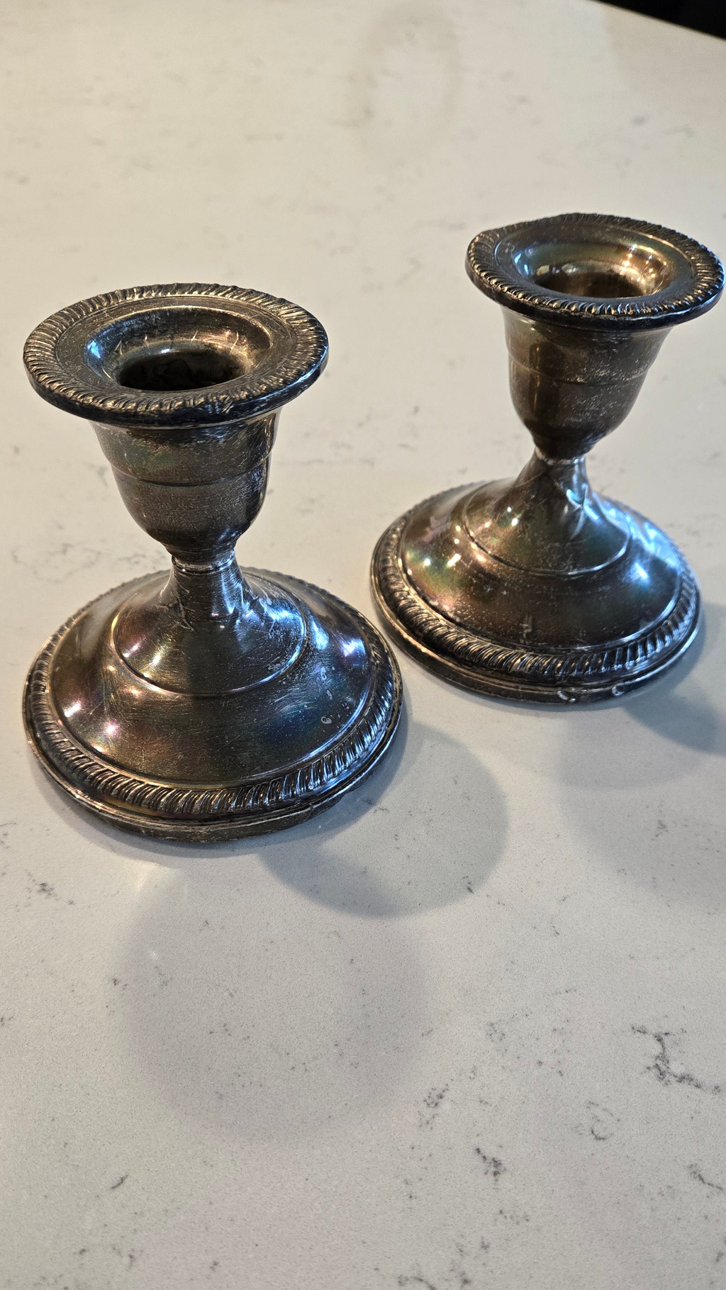 Pair Sterling Silver weighted Fisher Silversmith candle holders.