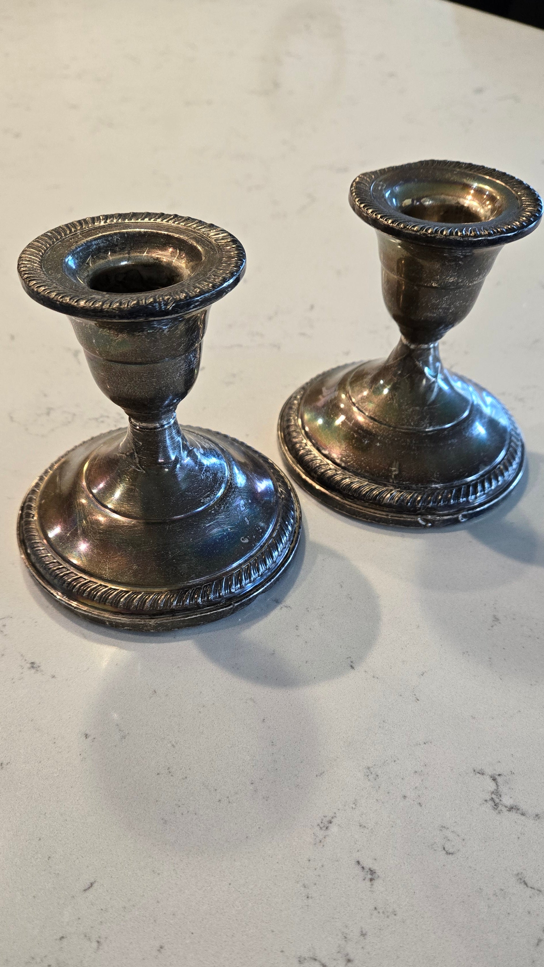Pair Sterling Silver weighted Fisher Silversmith candle holders.